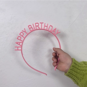 Pink Happy Birthday headband for children party with anti-slip design on white background