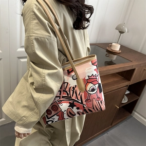 Graffiti tote bag with red monster art and long leather straps for women