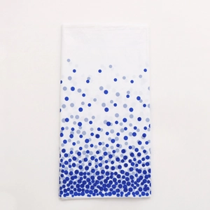 Detail of thickened rectangular tablecloth with blue gradient polka dot pattern
