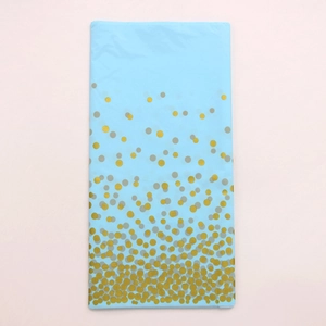 Detail of light blue rectangle tablecloth with gold foil gradient polka dots pattern