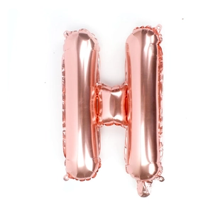 Detail view of the rose gold foil balloon in alphabet H shape with metallic reflection