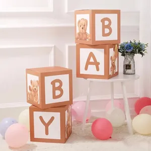 Detailed view of BABY letter decoration boxes with teddy bear prints for birthday parties