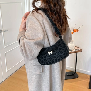 Fashionable black leopard print shoulder bag with silver butterfly accent for winter