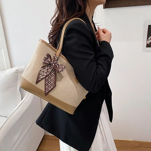 Large capacity canvas tote bag with brown leather trim and decorative silk scarf