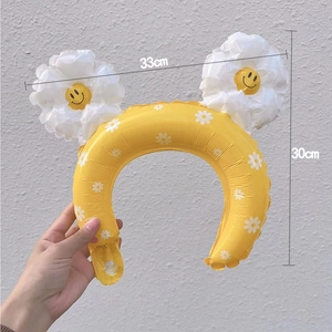 Yellow inflatable daisy headband balloon with smiley face design for party favors