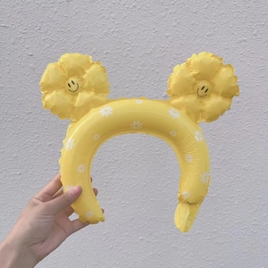 Inflatable yellow headband with sunflower smiley face and daisy prints for party props