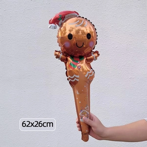Detailed view of gingerbread man foil balloon with dimensions 62x26cm for party props