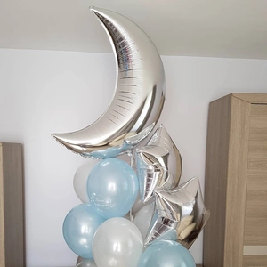 Detail of silver moon and star foil balloons with custom blue baptism latex balloons