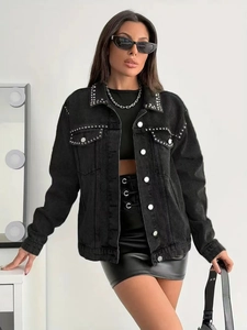 Close-up of silver studs on the collar and pockets of this black denim jacket for women