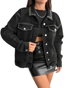 Detail of black denim jacket featuring silver studs and rhinestones on the collar