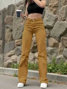 Street style view of high waisted mustard yellow straight leg jeans with classic pockets