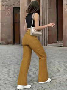 Side view of ginger yellow high-waisted straight-leg jeans with stretch fabric for women