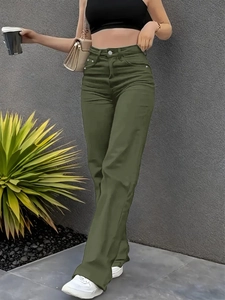 Outdoor shot of high-waist olive green straight-leg jeans with classic five-pocket style