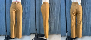 Detailed views of mustard yellow high waisted wide leg jeans with classic five-pocket design