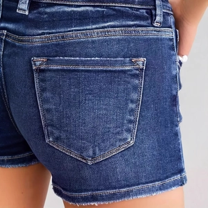 Back view of slim fit dark blue distressed denim shorts with functional rear pockets