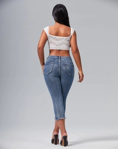 Slim fit washed denim shorts for women featuring distressed frayed hems and back view