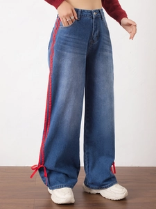 Dark blue wide-leg jeans with red side stripes and stylish bow ties at the cuffs