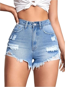 Detail view of high-waisted blue denim shorts with distressed holes and fringe hem design