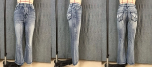 Detailed views of vintage blue flared jeans with cross wing embroidery on back pockets