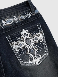 Slim fit flared jeans with ornate cross embroidery and rhinestone studs on back pocket