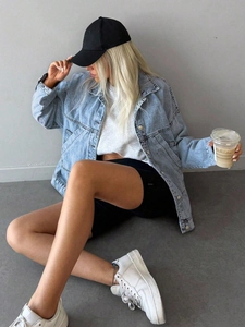 Relaxed fit light blue wash denim jacket with drop shoulder and oversized pockets for women