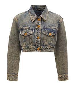 Detail of retro washed blue cropped denim jacket featuring chest pockets and classic collar