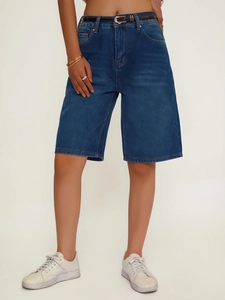 Detail of high-waisted dark blue denim shorts with a slim black belt and straight-leg cut