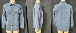 Detail of light blue denim jacket featuring utility pockets and dropped shoulder design