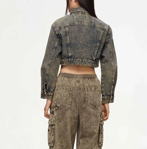 Rear view of vintage acid wash denim jacket and cargo pants in yellowish brown tone