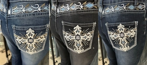 Detail of ethnic embroidery and sequins on back pockets of slim flare jeans