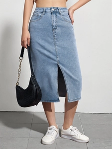 Close-up of high waist light blue denim midi skirt featuring a front slit design