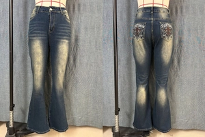Close-up of vintage dark blue flared jeans featuring Lost Souls embroidery on back pockets