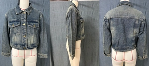 Three-way view of a retro washed blue denim jacket with cropped cut and chest pockets