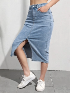 Detailed view of high waist light blue denim midi skirt with a front slit and pockets