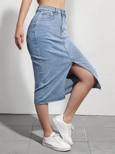 Detailed side view of high-waist light blue denim skirt featuring a front slit design