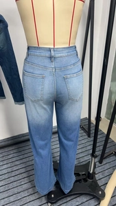 Detailed back view of light blue high waist wide leg jeans with dual patch pockets