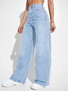 Detail shot of light blue high-waisted wide-leg jeans with classic metallic button closure