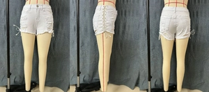 Detailed views of white denim shorts featuring side lace-up ties and distressed ripped hem