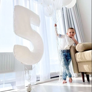 Detailed view of 40-inch white number 5 foil balloon for birthday party decoration