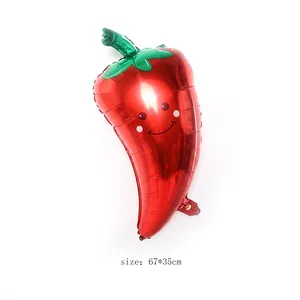 Detailed view of red chili pepper foil balloon with a smiley face measuring 67x35cm