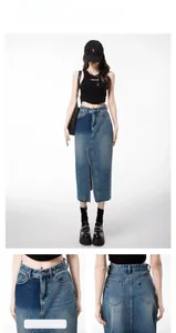 Detail view of high waist denim skirt with split front design and contrast stitching