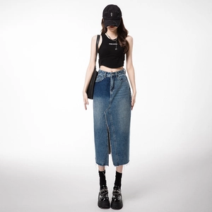 High-waisted split denim maxi skirt with color-blocking and frayed hem details