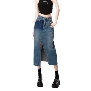 High-waisted patchwork denim skirt with front split and raw edges for a casual retro look