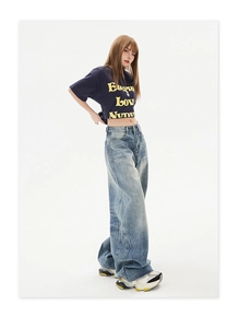 Close-up of high-waisted wide-leg denim pants in light blue washed vintage style