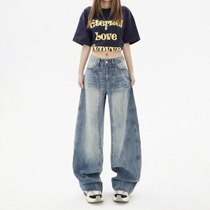 Women's light blue vintage high-waisted oversized wide-leg denim jeans with washed effect