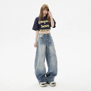 Retro high-waisted wide-leg denim jeans in light blue wash with a raw hem edge