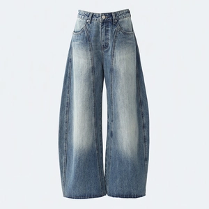 Women's vintage high waist barrel leg jeans with central seams and washed denim finish