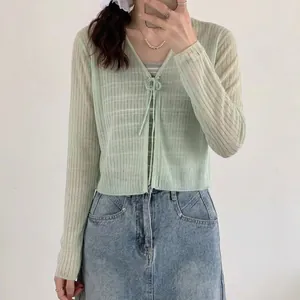 Summer outfit featuring light green knit cardigan and blue denim A-line mini skirt