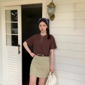 Fashionable brown t-shirt with bow embroidery and beige cargo denim skirt set