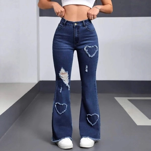 Front view of high waist flare jeans featuring heart-shaped patchwork and distressed holes